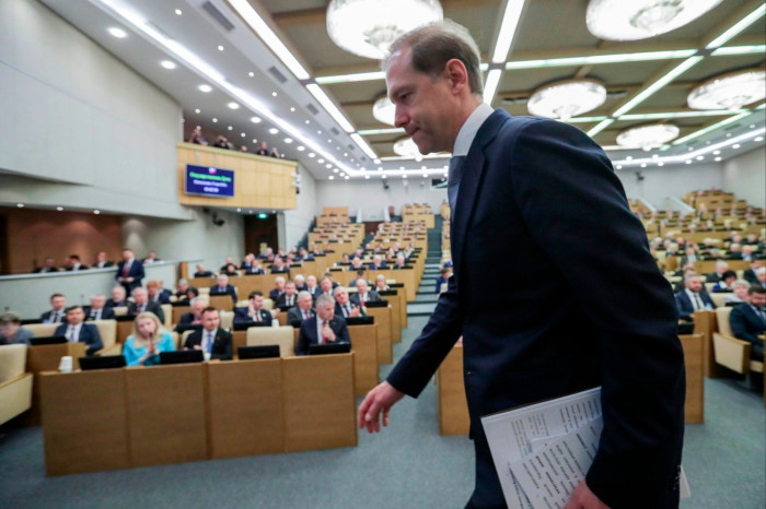 Denis Manturov leaves after addressing the State Duma, Lower House of the Russian Parliament, in Moscow on Monday