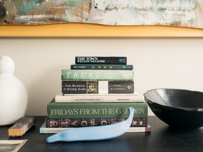 A few of Jessica Bell Brown’s recent reads – with a ceramic plantain given to her by the artist Simone Leigh