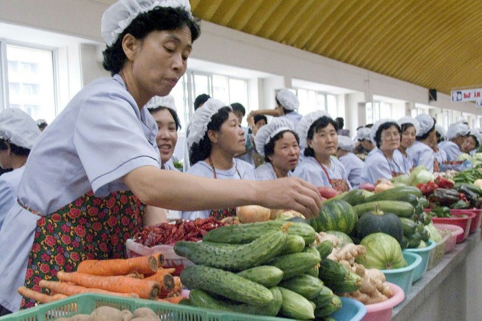 Women work at a market in Pyongyang. By 2020, there were at least 436 official markets in North Korea, each with up to 20,000 stalls operated exclusively by women and raising about $56.8m per year in revenue for the government