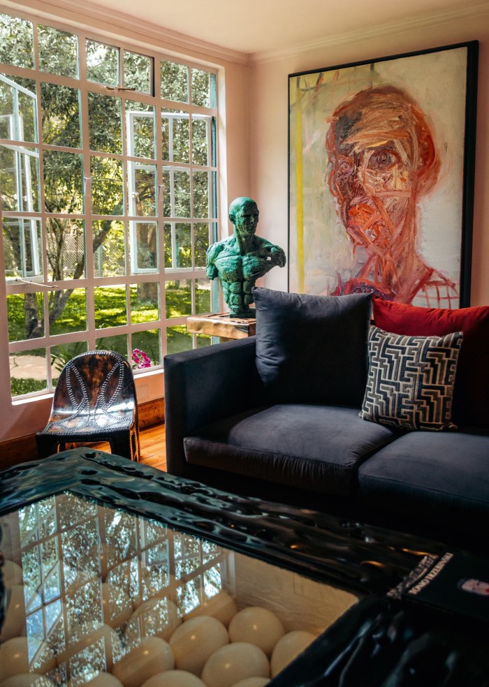 The drawing room in the studio annex, with a sculpture by Stanislaw Trzebinski and a painting by Tonio Trzebinski