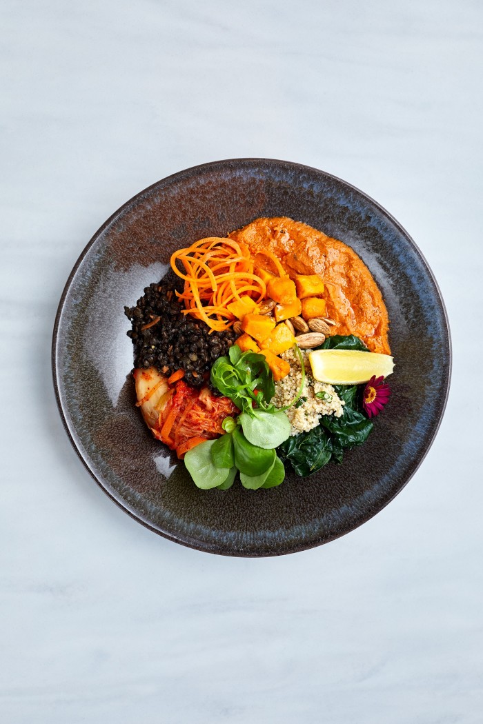 Adesse’s plant bowl with black lentils, quinoa, kale, seasonal vegetables and romesco