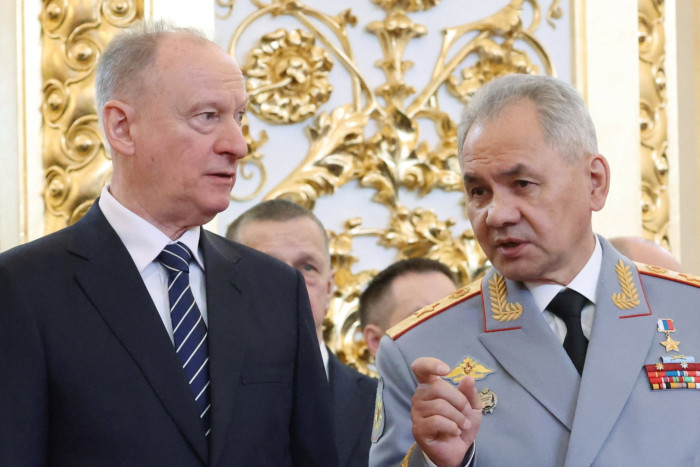 Nikolai Patrushev, left, talks to Sergei Shoigu in the Kremlin  