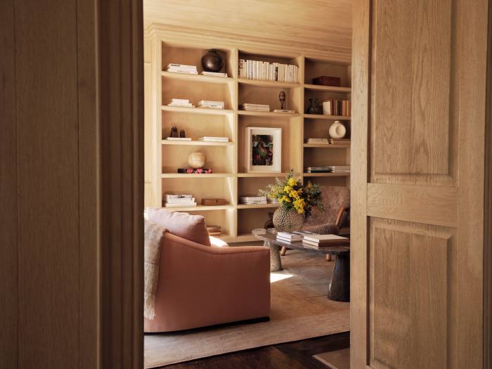 The pink room, with built-in shelving that houses objects and artefacts