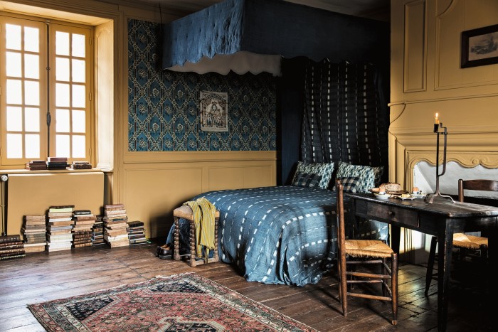 The “yellow bedroom”, with Guirlandes de Fleurs wallpaper, €160 a roll