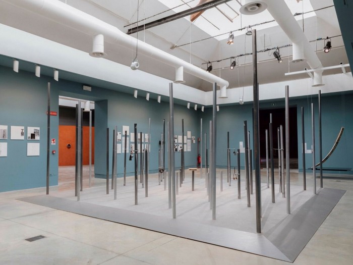 Vertical metal rods installed in an art gallery