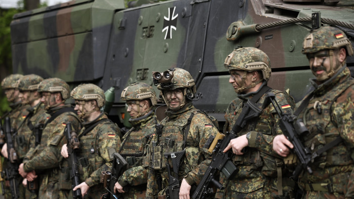 German soldiers in front of a military vehicle 