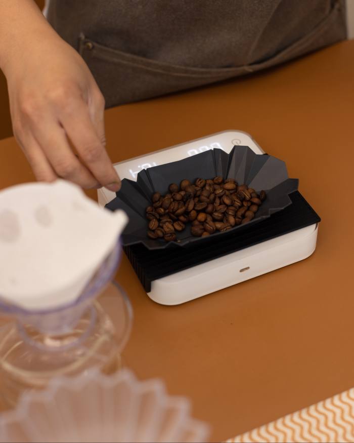 Weighing coffee beans at Melbourne’s Puzzle Coffee 