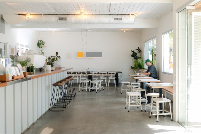 The bar room at 33 Acres Brewing Company – all white walls and polished concrete flooring 