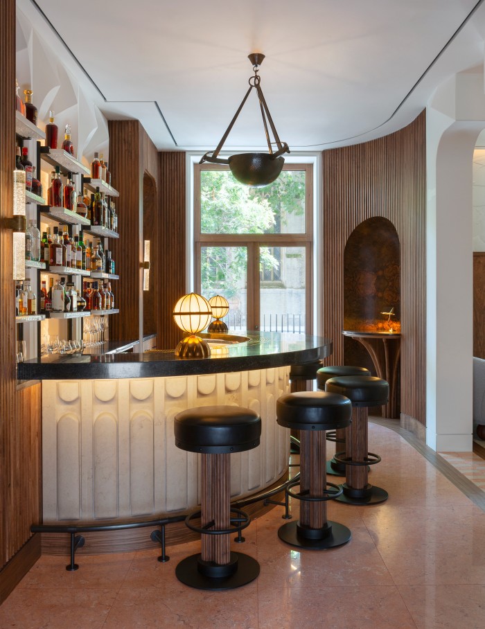 Light wood walls and sorbet colours feature in the bar