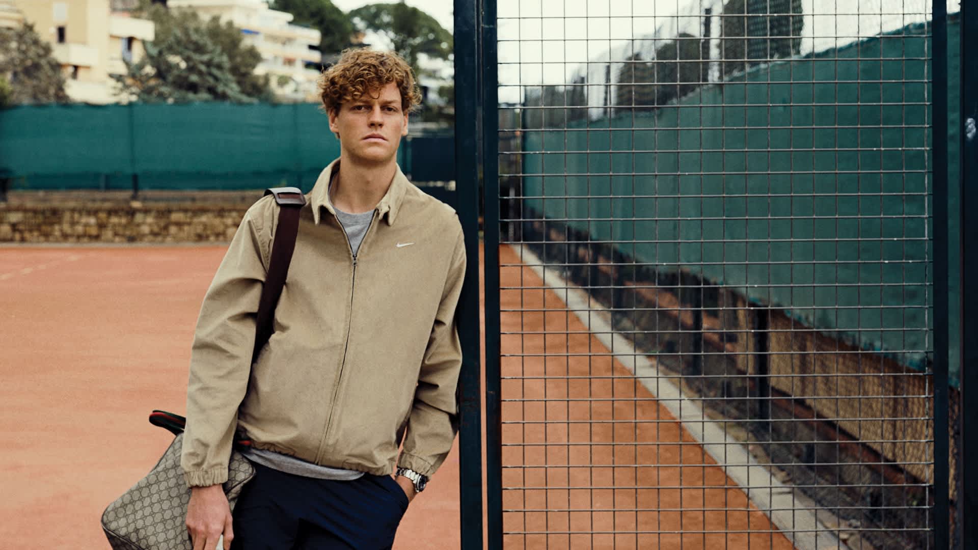 Nike cotton Harrington jacket, £61.65, cotton T-shirt, £22.99, elastane tennis shorts, £54.99, cotton socks, £16.99, and mesh Court Air Zoom Vapor Pro 2 sneakers, £83,99. Gucci canvas leather duffle bag, Rolex Oystersteel Oyster Perpetual Submariner watch and Head racket, all Sinner’s own