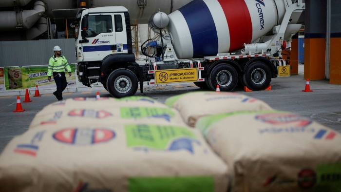A worker walks next to a cement mixer truck at a concrete plant of Mexican cement maker CEMEX in Monterrey, Mexico January 25, 2020