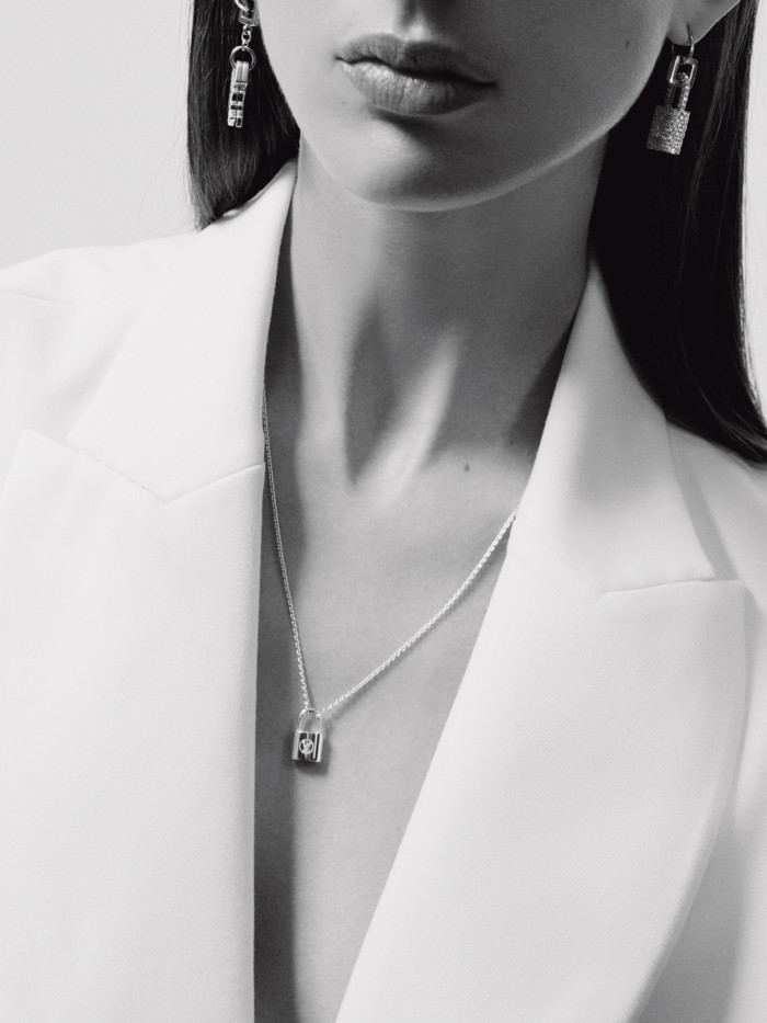 Louis Vuitton for Unicef silver Lockit pendant and chain, £555, and white-gold and diamond Lockit padlock and key pendants (worn as earrings), both POA. MM6 Maison Margiela wool jacket, £770