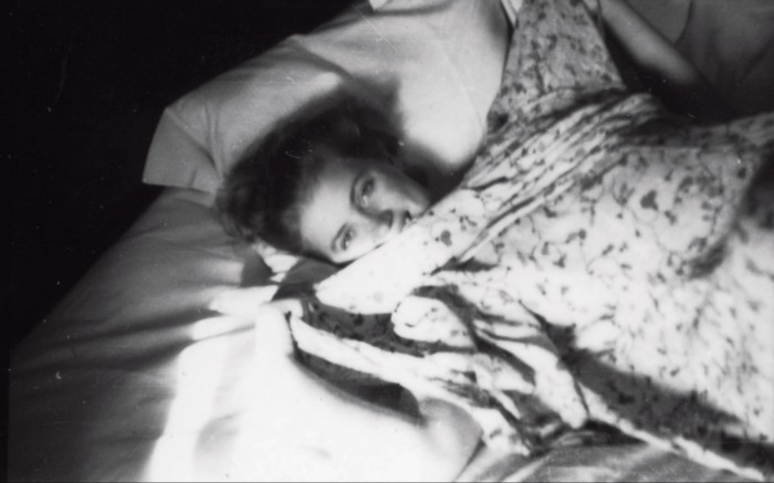 Miller in bed in Bruges, 1937, photographed by Penrose