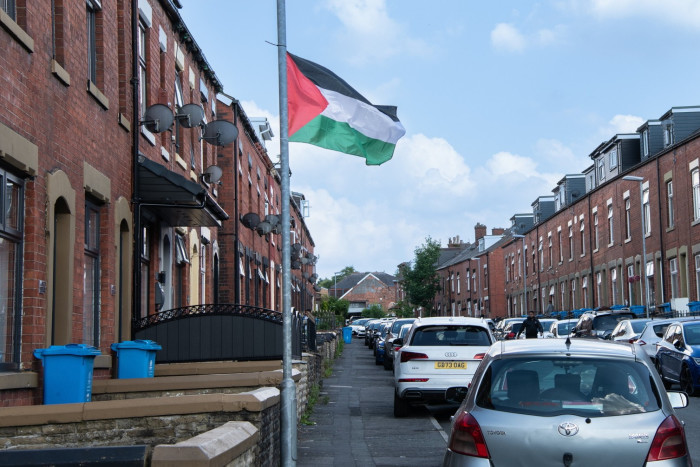 Palestinian flags fluttering from lamp posts 