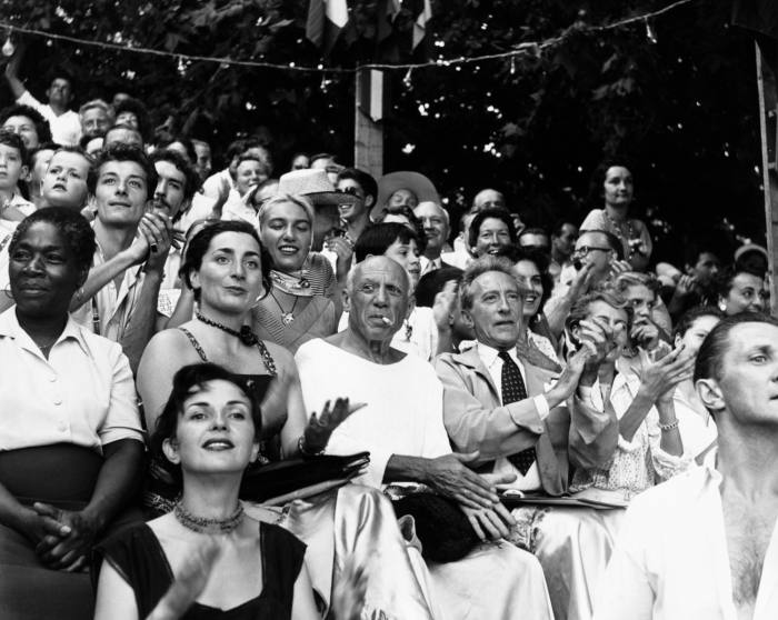 Pablo Picasso at a bullfight in Vallauris, France, with his wife Jacqueline (left) and Jean Cocteau (right). Behind them sits Picasso’s daughter Maya wearing a scarf