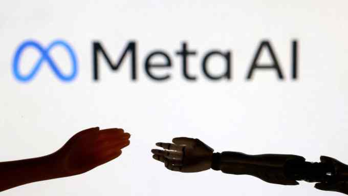 Hand reaches out to shake robot’s hand in front of a Meta AI logo