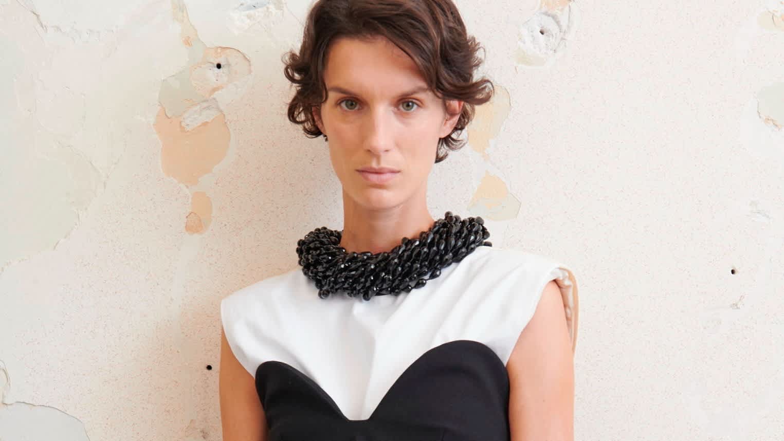 Female model wearing a black and white dress