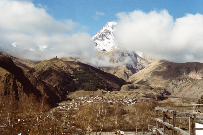 Kazbegi mountain, with Gergeti Trinity Church silhouetted in front of it