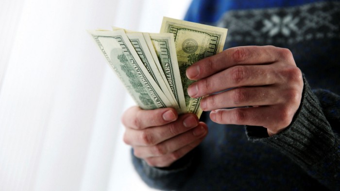 Closeup portrait of male hands holding US dollars