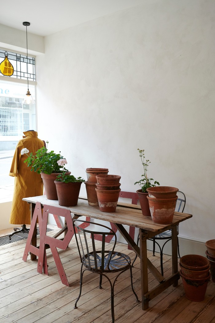 Old terracotta plant pots, antique chairs, and dry-waxed duster coat, £240