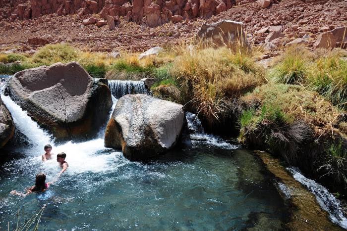 Bathers in the mineral thermal waters near San Pedro de Atacama, Chile