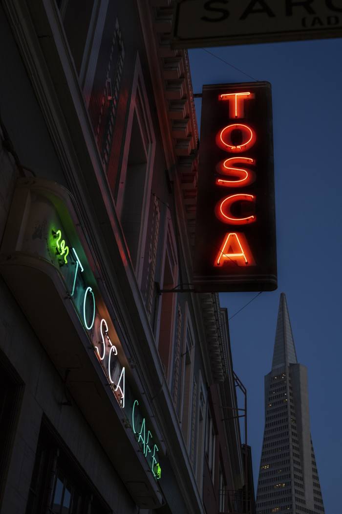 The neon sign for Tosca Café near Chinatown