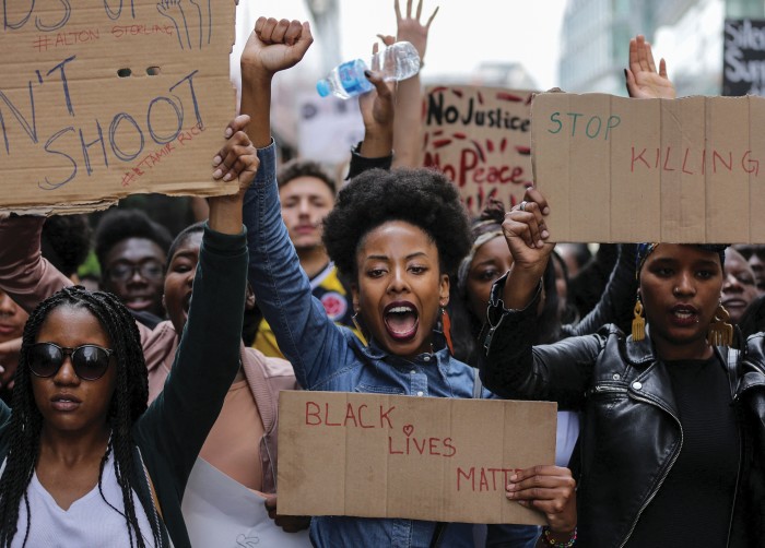 Demonstrators from the Black Lives Matter movement march through central London on July 10, 2016