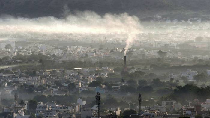 Clear case: Smoke billows from a factory chimney in Ajmer, India