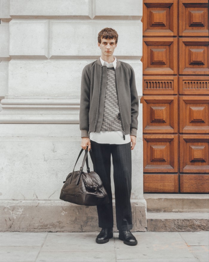 Giorgio Armani pleated leather duffel bag, £2,900, cashmere jacket, £3,150, and mohair and alpaca jacquard jumper, £840. Margaret Howell cotton shirt, £325. Miu Miu silk and cotton trousers, £1,210. John Lobb leather Oxford Linwood lace-up shoes, £1,370