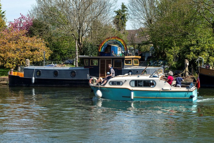 A houseboat and a smaller boat on the Thames at Old Windsor