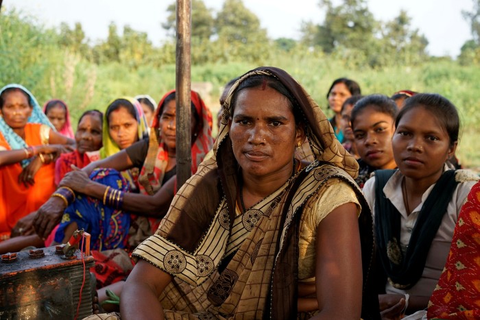 Dhan Kunwar pictured with a group of other women rice paddy farmers who are being pushed off their land by the encroaching coal mine