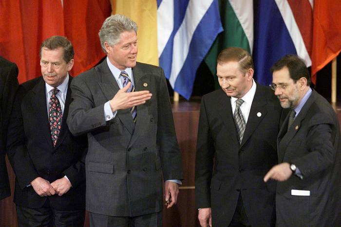From left: Czech president Vaclav Havel, Bill Clinton, Ukraine’s Leonid Kuchma and Nato secretary-general Javier on stage with their countries’ flags at Nato’s 1999 summit in Washington 