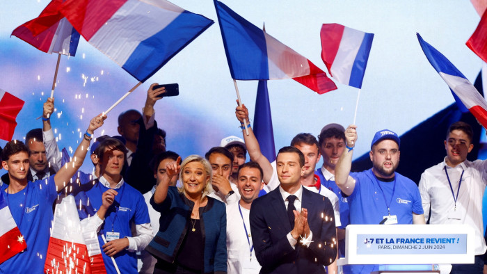 Marine Le Pen, centre, attends a rally for her far-right party Rassemblement National ahead of the EU elections earlier this month 