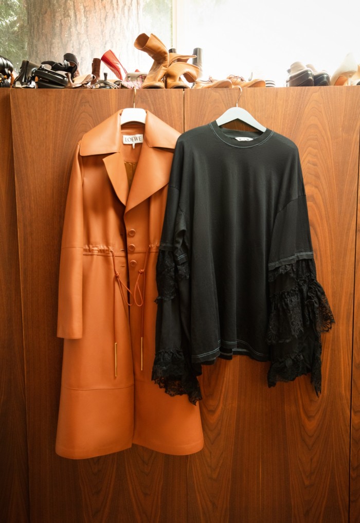 A Loewe trench coat and Balenciaga lace-sleeve T-shirt in Welch’s dressing room