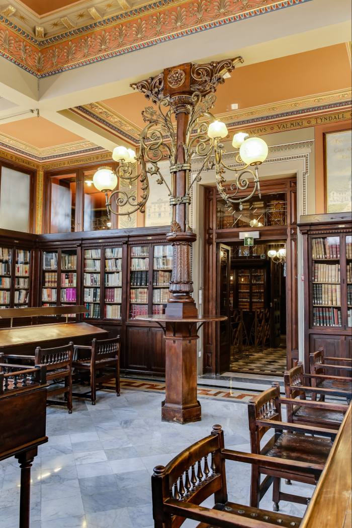 The ornate reading room includes panels with the names of Catalan’s prominent cultural figures
