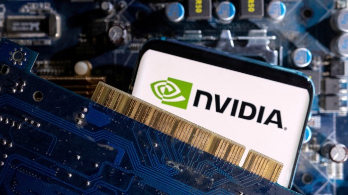 Phone with Nvidia logo on screen with computer motherboard