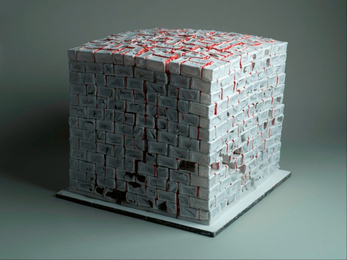 A large cube made of white porcelain bricks