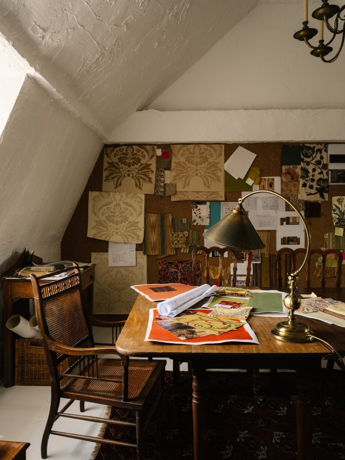 Renzullo’s studio in his mansard-roofed attic, with its chair by the 19th-century architect/designer EW Godwin and various fabrics and materials