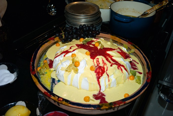 Giant pavlova with raspberry and crème anglaise for dessert