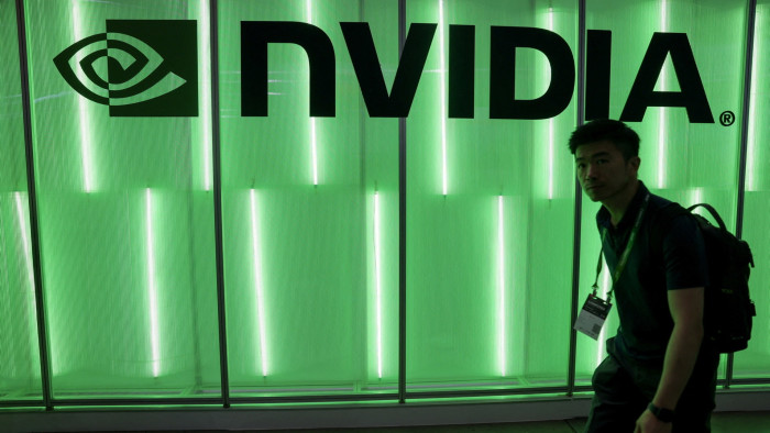 A person walks past an Nvidia logo at Computex in Taipei, Taiwan