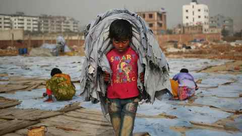 Ten-year old Mustakin working in Dhaka, Bangladesh, for one dollar a day