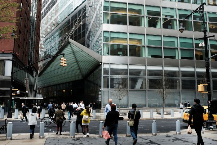 People walk by Goldman Sachs’ New York headquarters