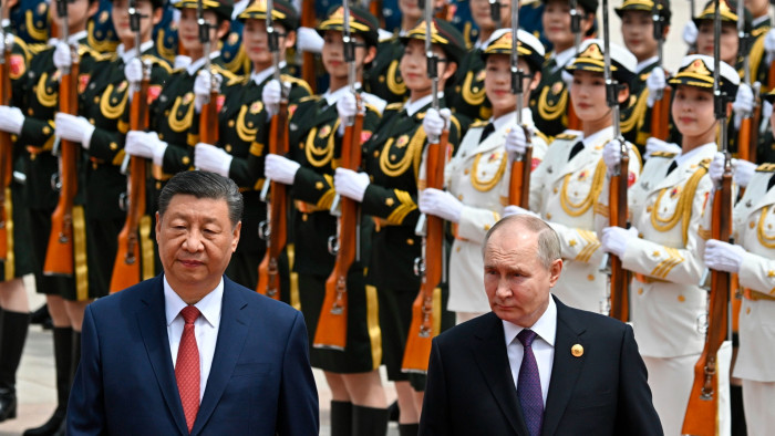 Xi Jinping and Vladimir Putin reviewing an honour guard