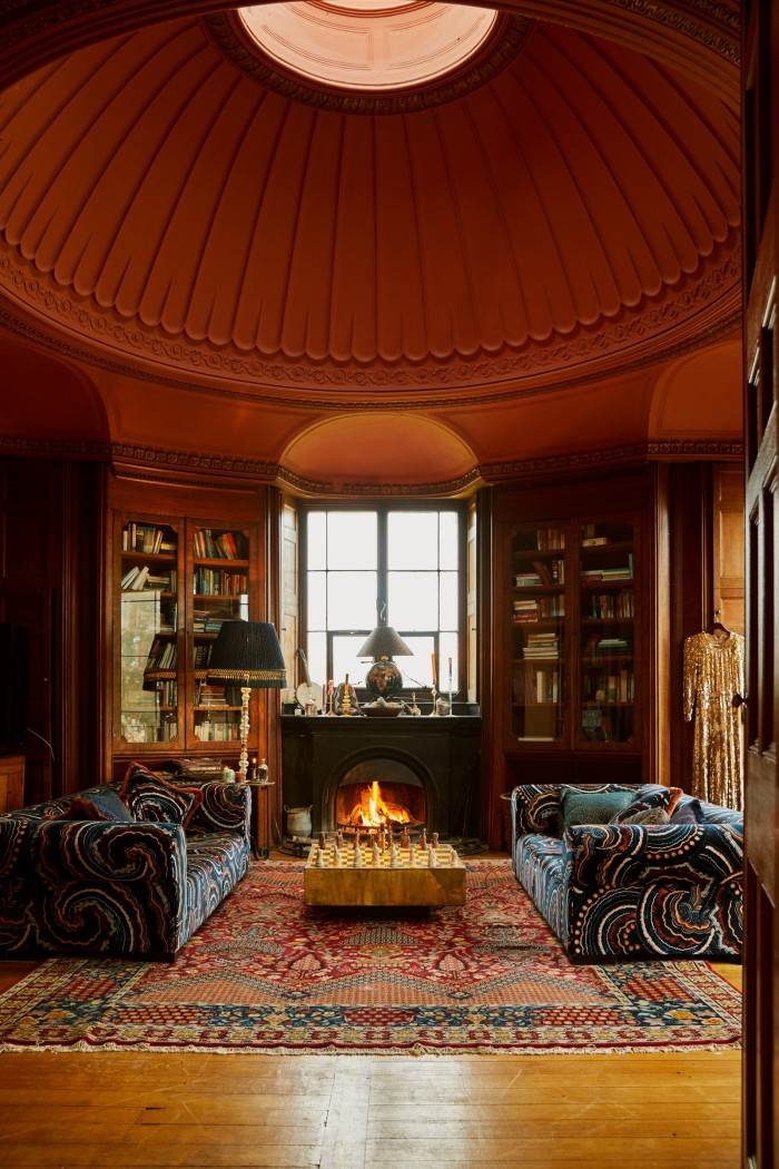 The library, with sofas upholstered in Fantasia velvet and cushions from the collection