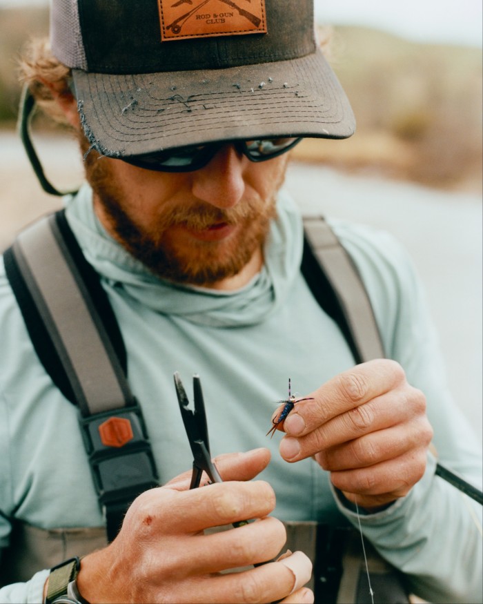 Fishing guide Nathan Parrish tying flies at Rock Creek