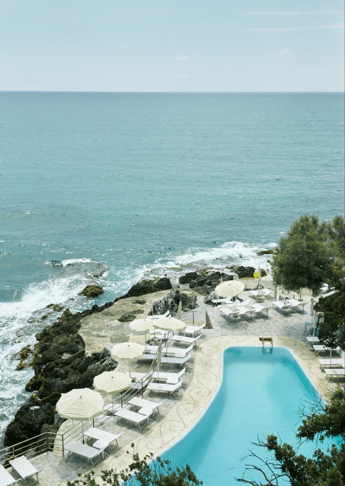 Aerial view of the pool at Hotel Punta Rossa, with the sea in the background