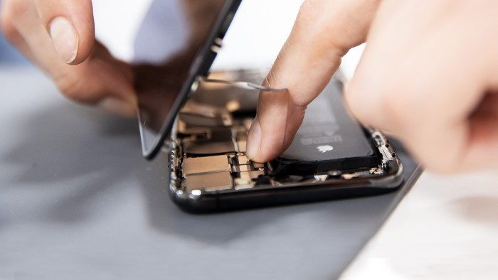 an iPhone undergoes mending for prolonged life