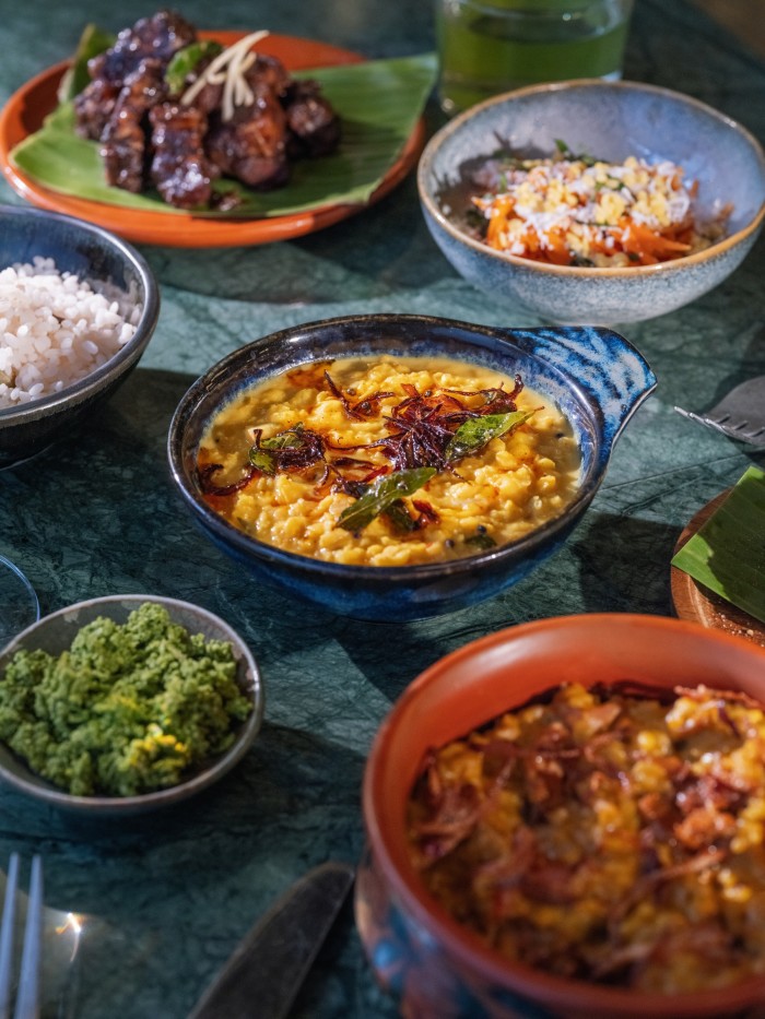 Dishes including coconut dal, sambol and sticky chicken pongal rice