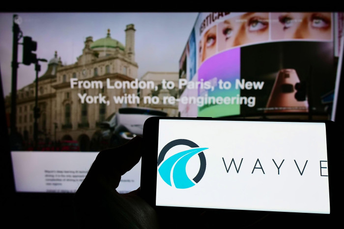 A smart phone displays the Wayve logo