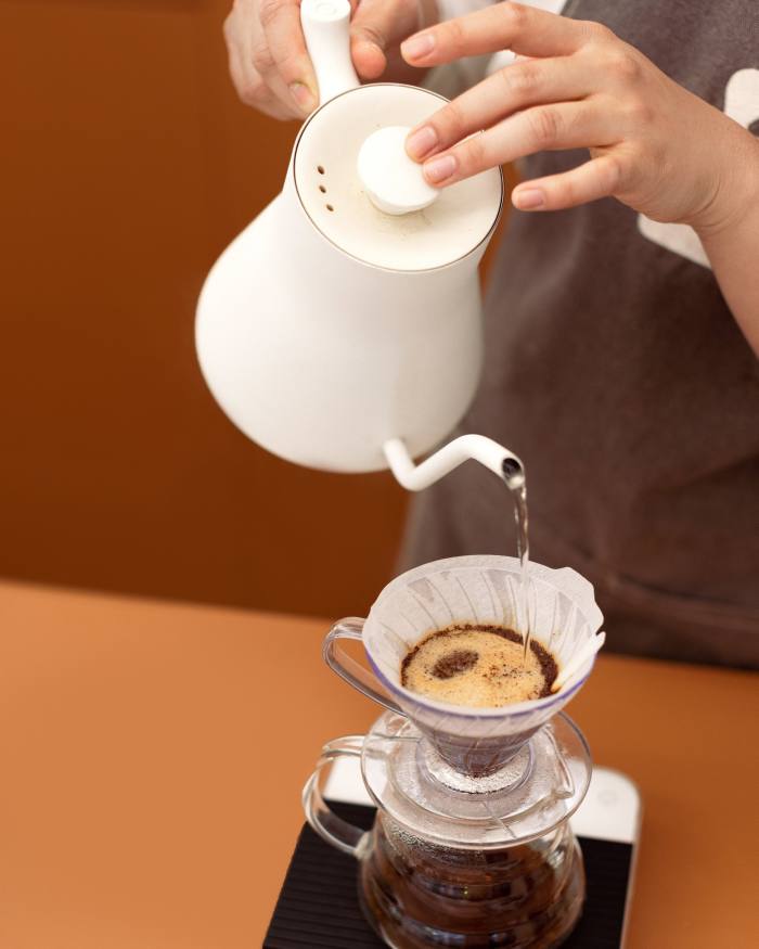 Pour-over coffee being prepared at Puzzle